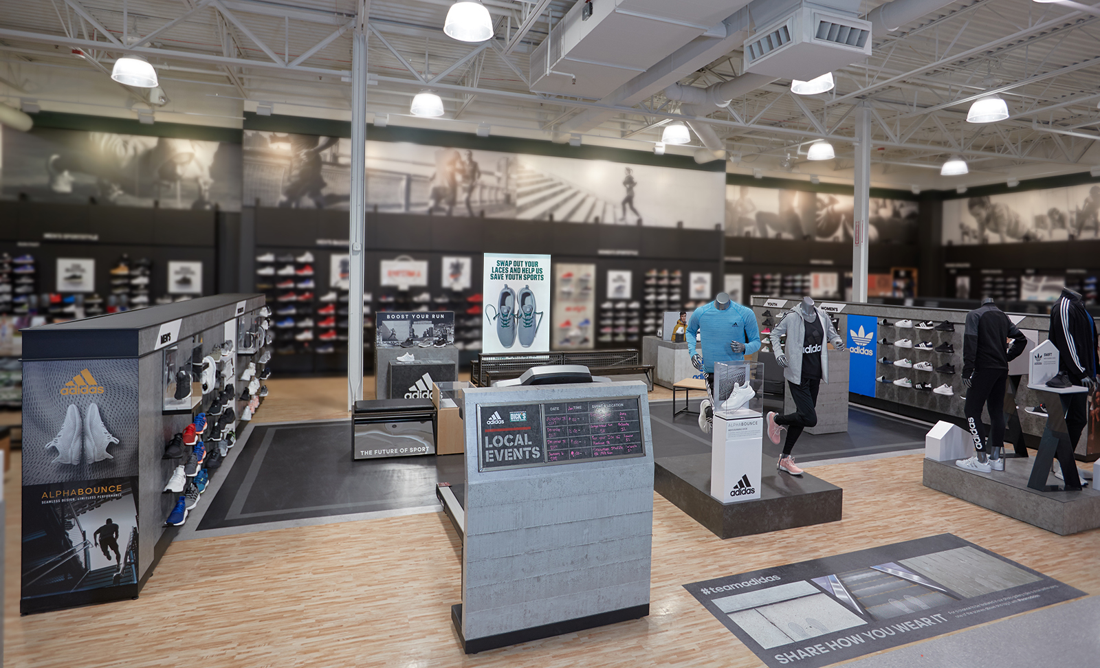 Full view of the custom designed space for Adidas that lives inside a sporting goods store.