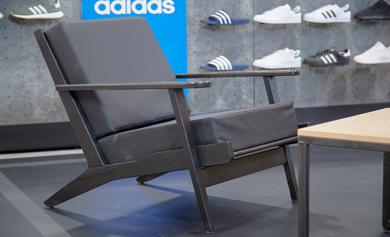 Custom built fixtures lie within the adidas retail space.