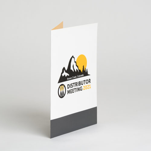 A custom pocket folder for Walker Mowers printed with "Distributor Meeting 2021" on the front.
