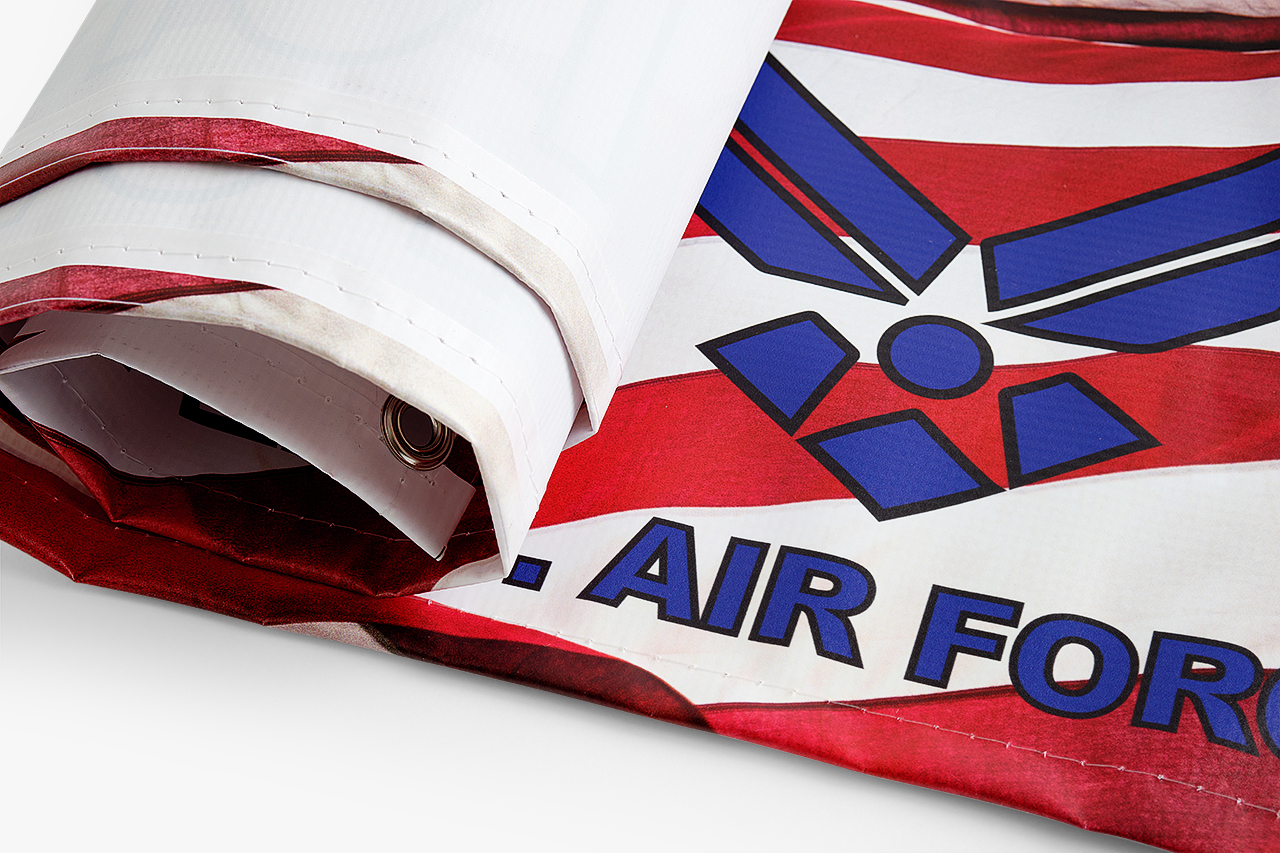 A rolled up hanging banner printed with a red, white and blue Air Force design.