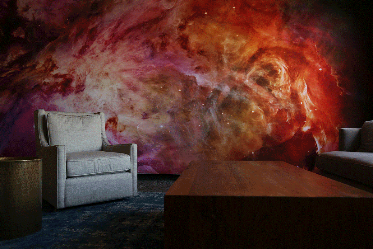 A silicone edge graphic with a space image in red, orange and pink color in an office lobby.