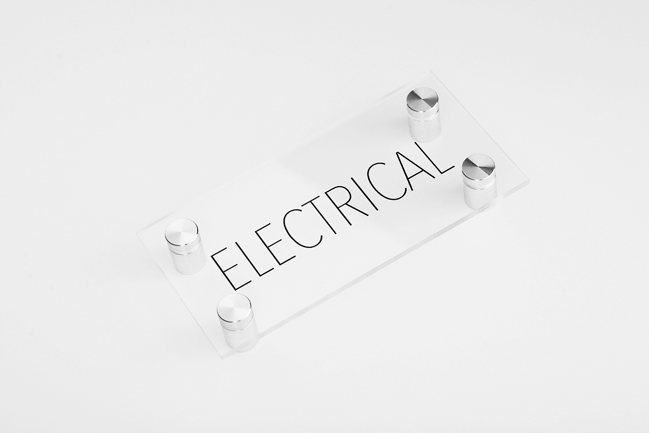 A clear acrylic utility sign with 