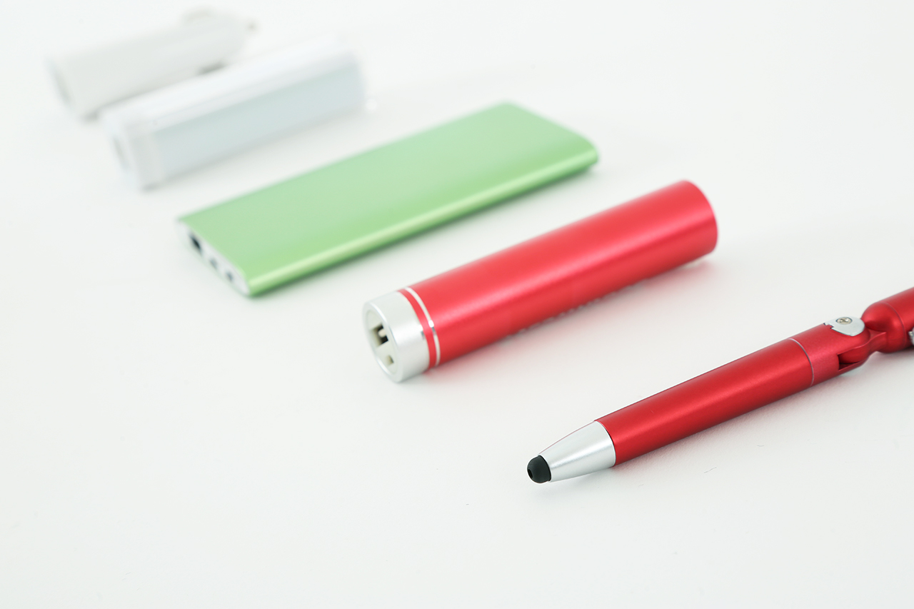 Five electronic promo items, including a stylus pen, charger and iPod.