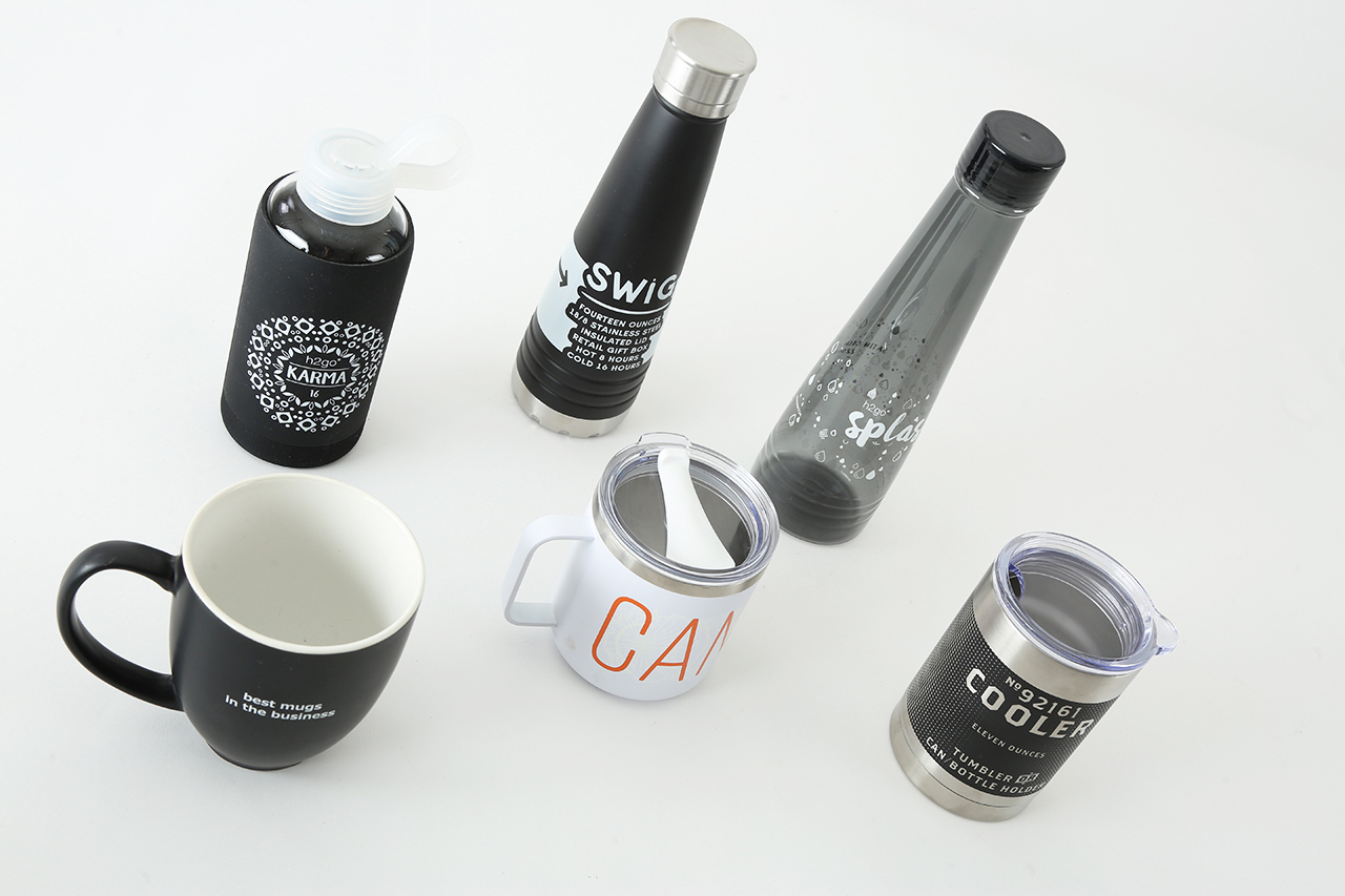 An array of promotional drinkware items, including water bottles, a coffee mug and tumblers.