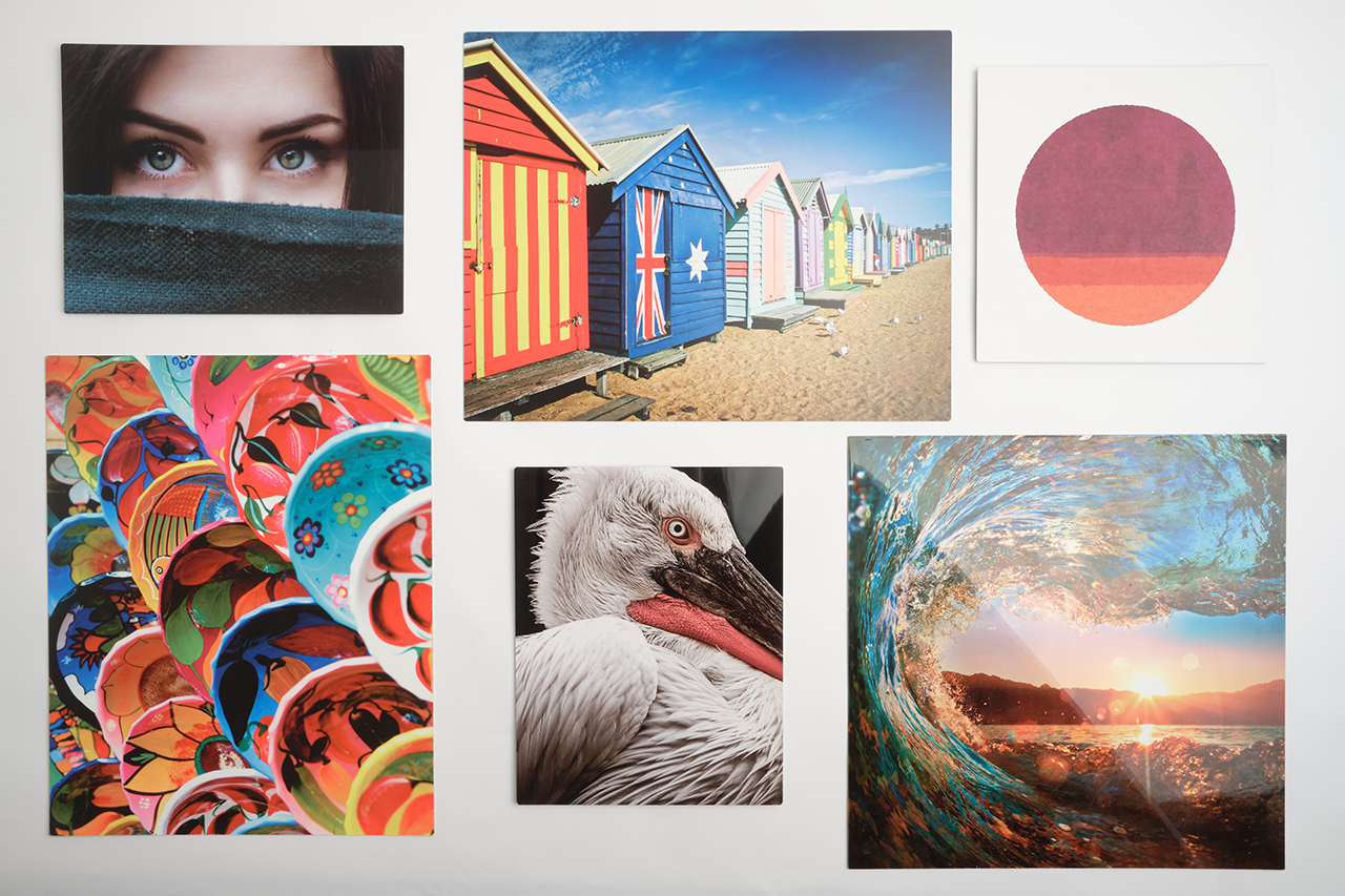 Six metal prints lined up in two rows with various custom artwork.