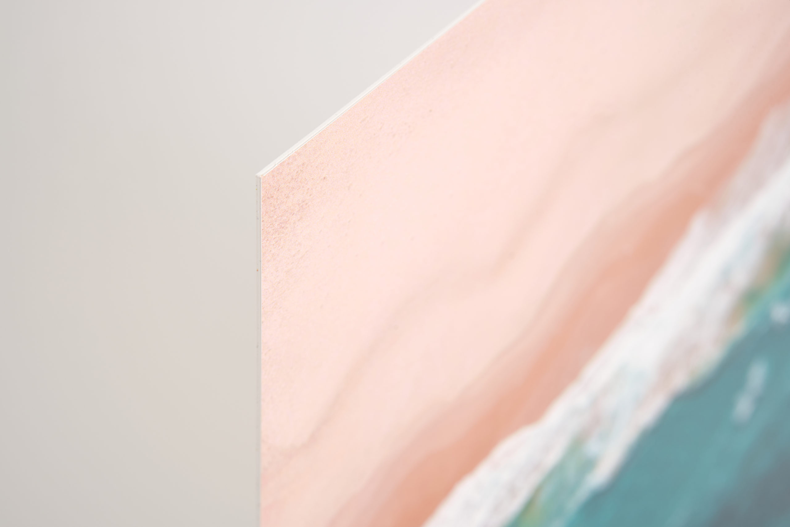 A styGreen eco-friendly sign with a beach and ocean design.