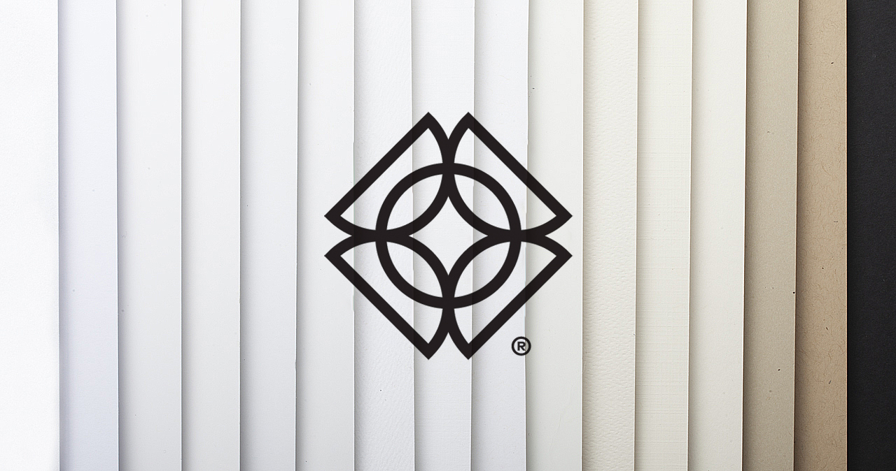 The Bernard Group logo over fanned-out paper stocks with neutral colors from white to black.