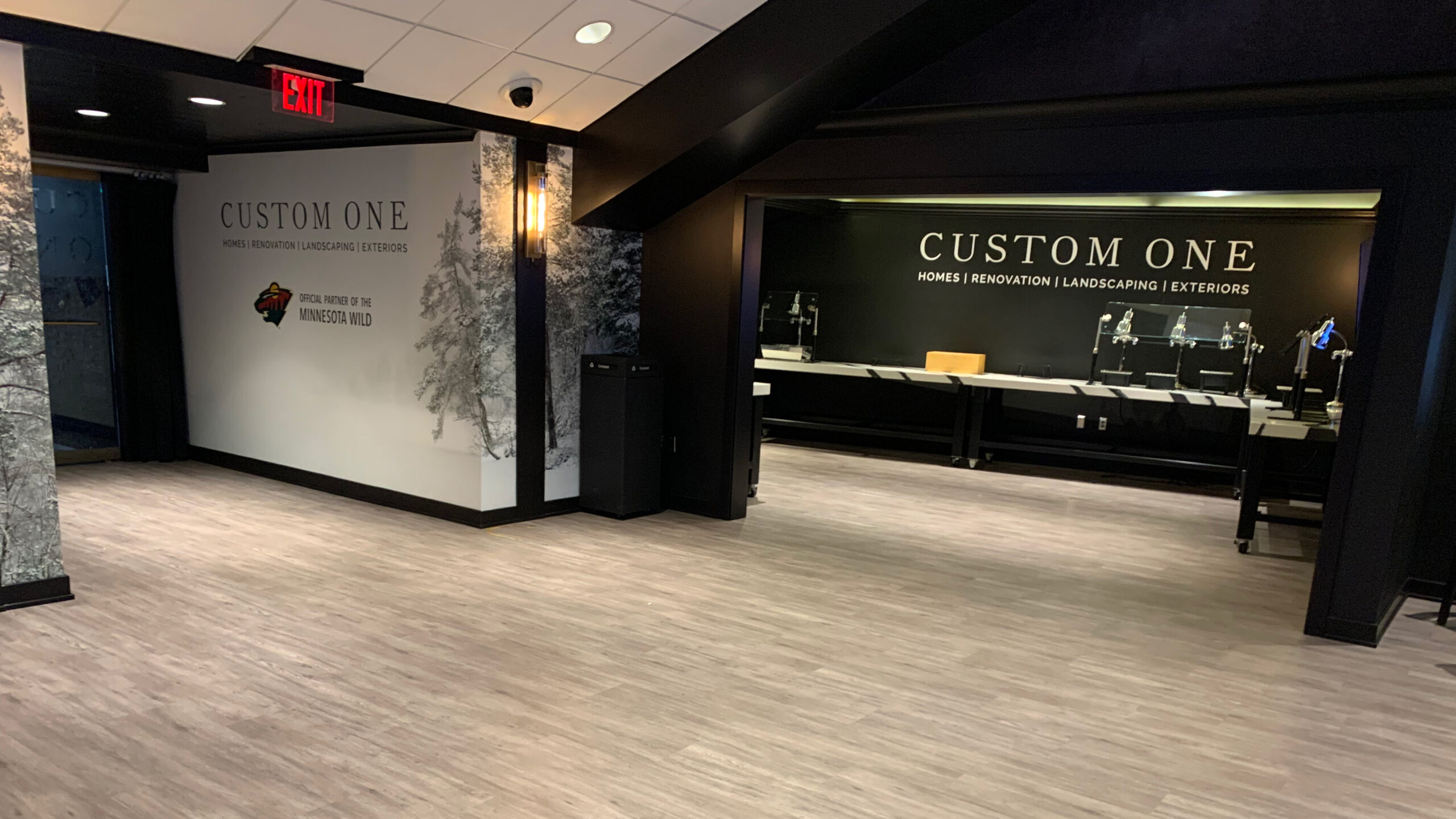 The Custom One Club with forest wall graphics and acrylic letters with a silver finish on the wall.