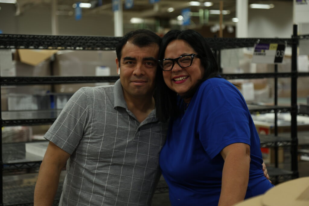 A man and a woman smiling for a photo