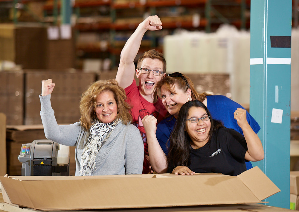 The Bernard Group employees smiling in the manufacturing area