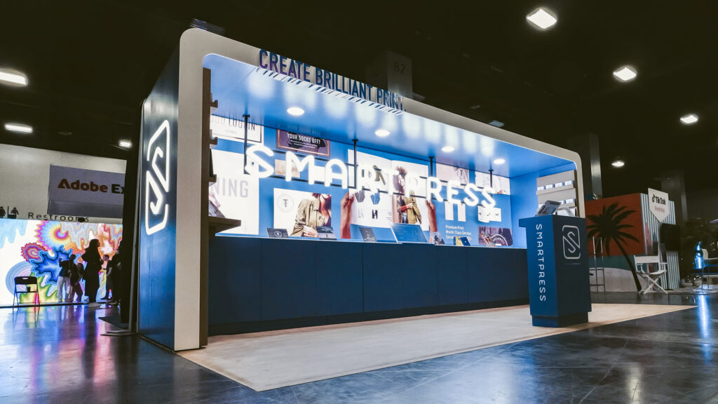 Smartpress' booth at Adobe Max, showcasing custom build and SEG lighting.
