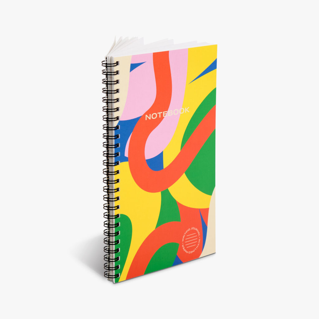 A notebook with a color-patterened cover.