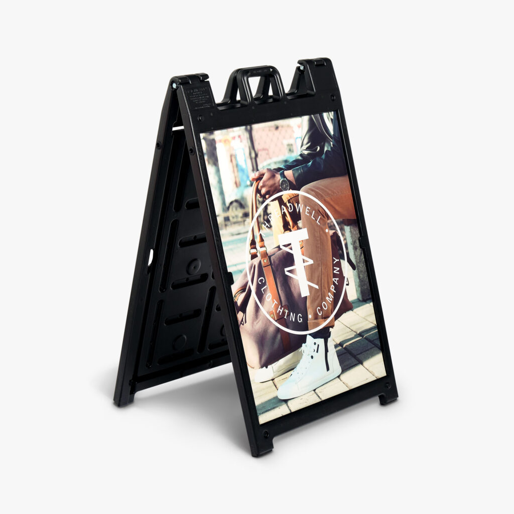 A-Frame sidewalk sign for Threadwell Clothing Company, featuring a man sitting with a khaki pant, white high-top shoes, and a high-end bag.