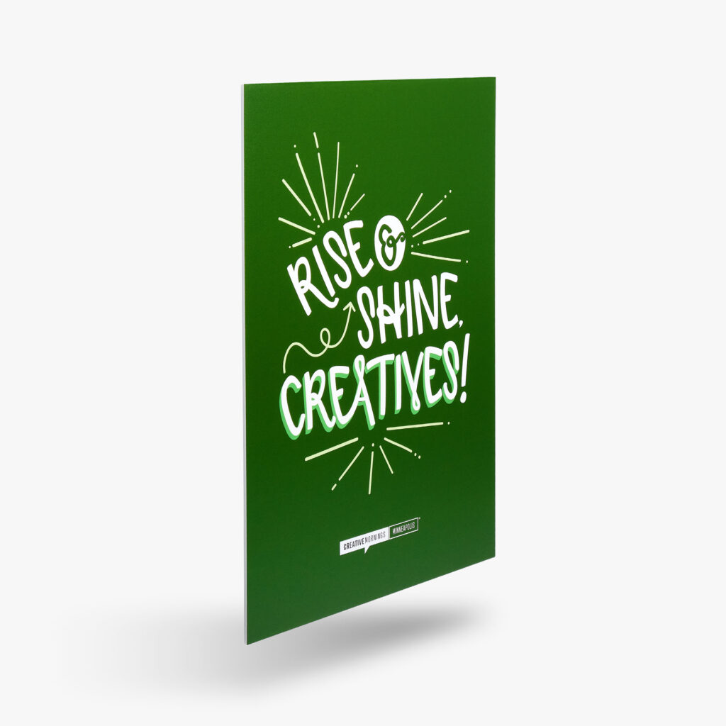 A foam sign with decorative typography stating, "rise & shine creatives!"