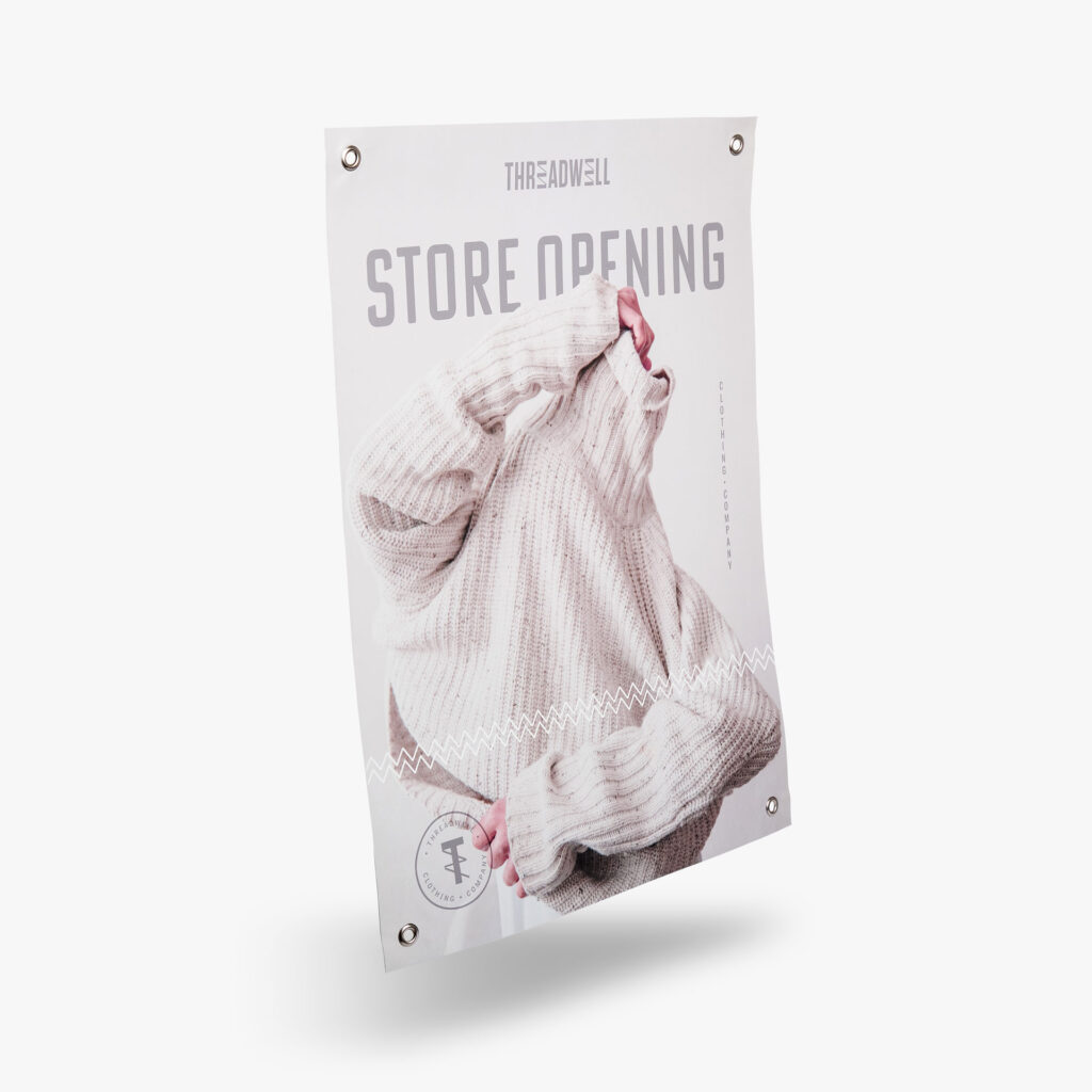 A banner for Treatwell for their store opening. The banner features a woman in a turtleneck. At the corners, there are grommets, a reinforced hole, to securely hang signage.