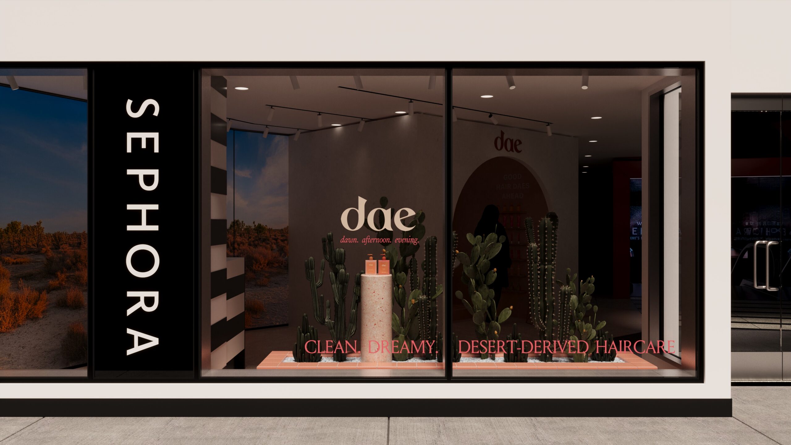 A Sephora store window display featuring a desert oasis theme with warm earth tones, cacti graphics, and a central podium showcasing Dae hair products.
