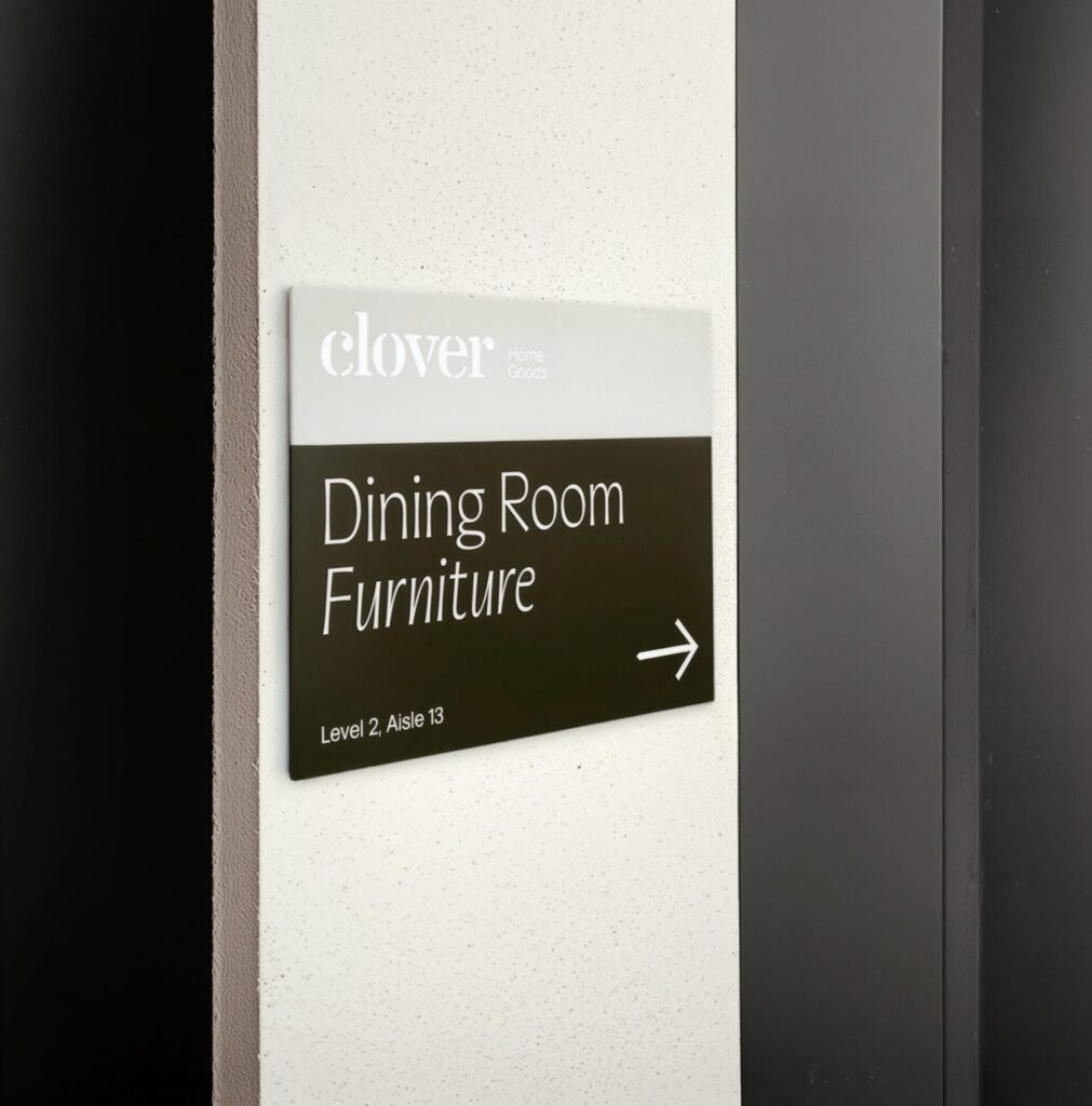 A foam board sign printed with Dining Room Furniture in white and an arrow pointing to the right.