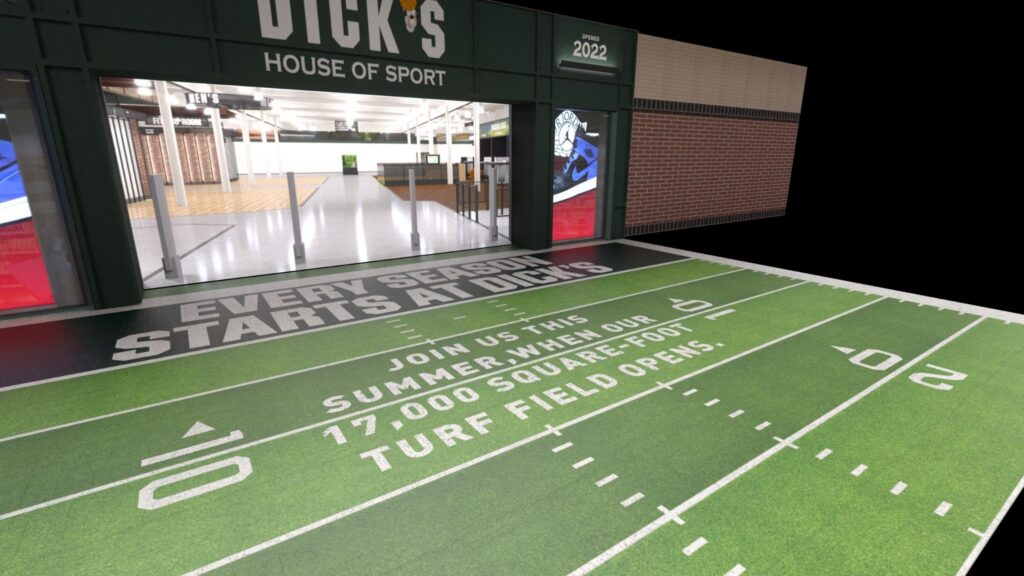 Experiential entrance for Dick's House of Sport featuring printed turf field floor graphics leading into the store threshold.