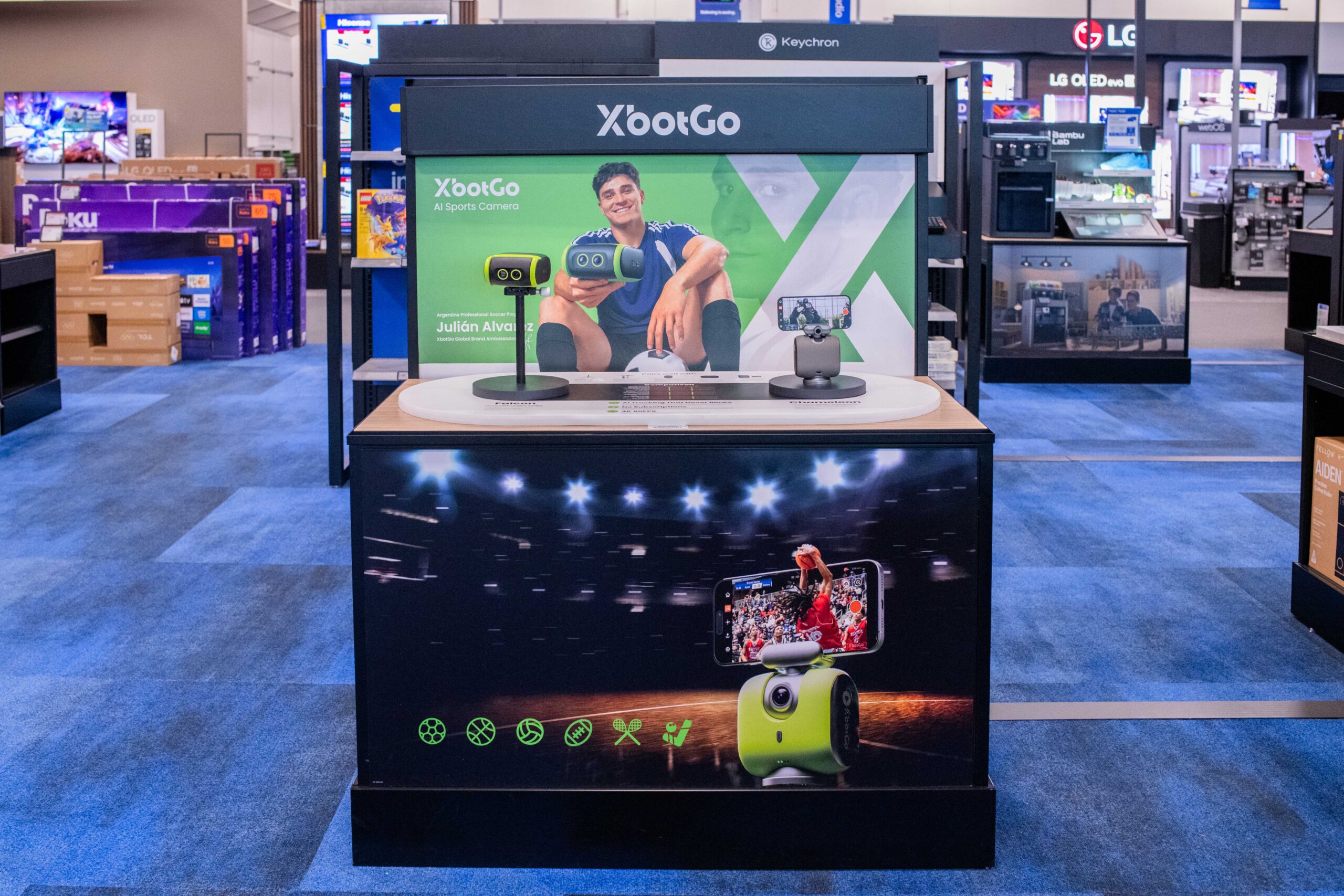 nteractive XBotGo retail rollout display featuring smart sports gimbal technology inside a Best Buy store aisle.