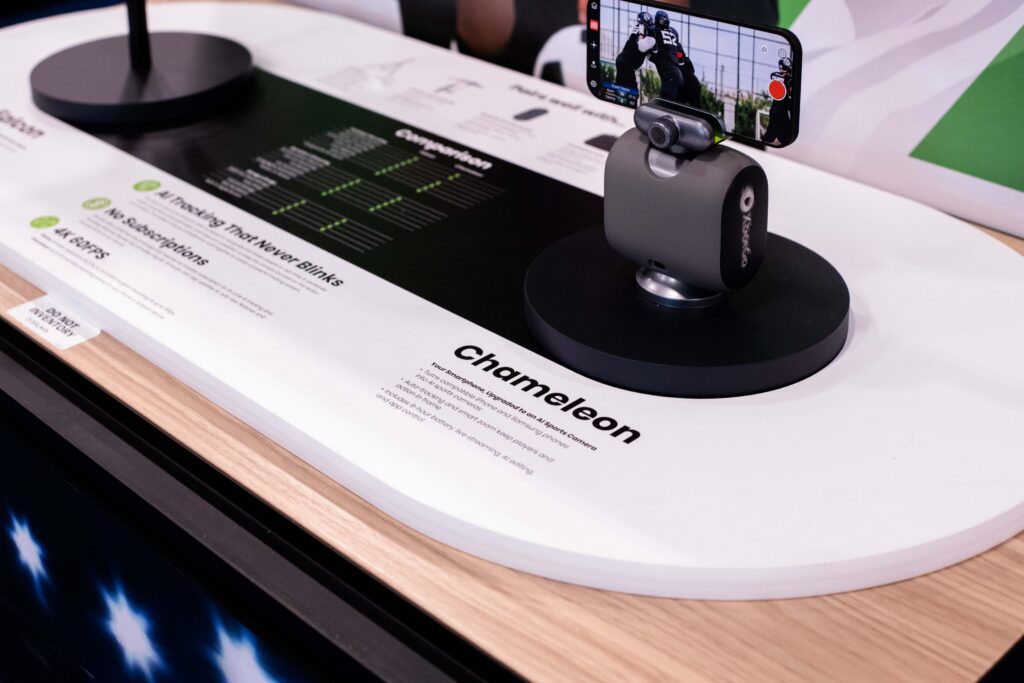 Close-up of the XBotGo AI tracking camera mounted on a retail display deck during a store retail rollout.